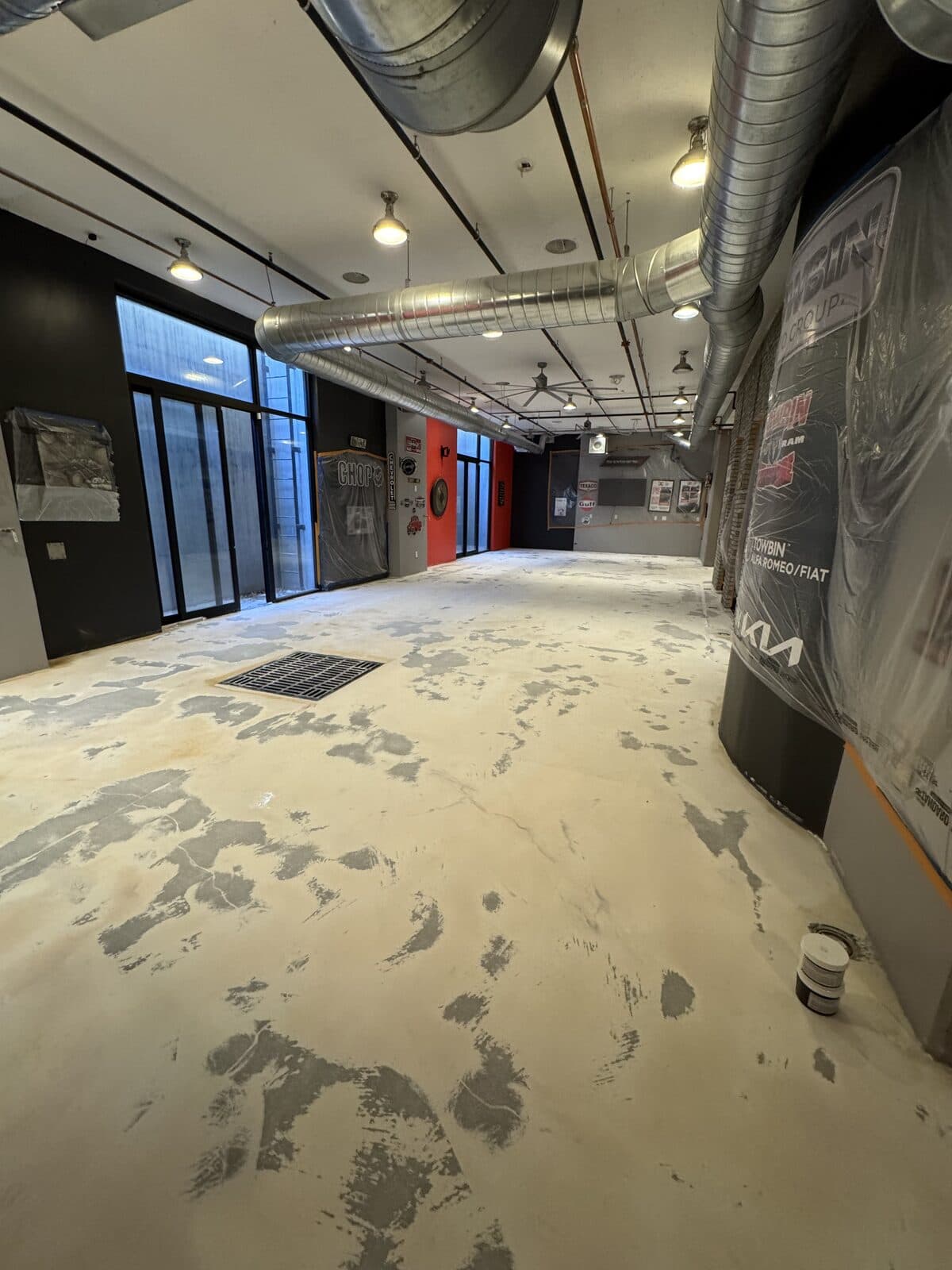 Raw concrete floor before metallic epoxy installation by ProShield Epoxy in Las Vegas commercial showroom