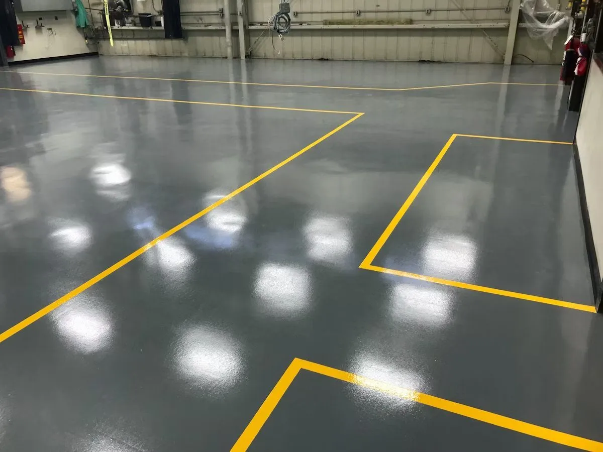 Commercial warehouse with solid color epoxy floor and safety line markings