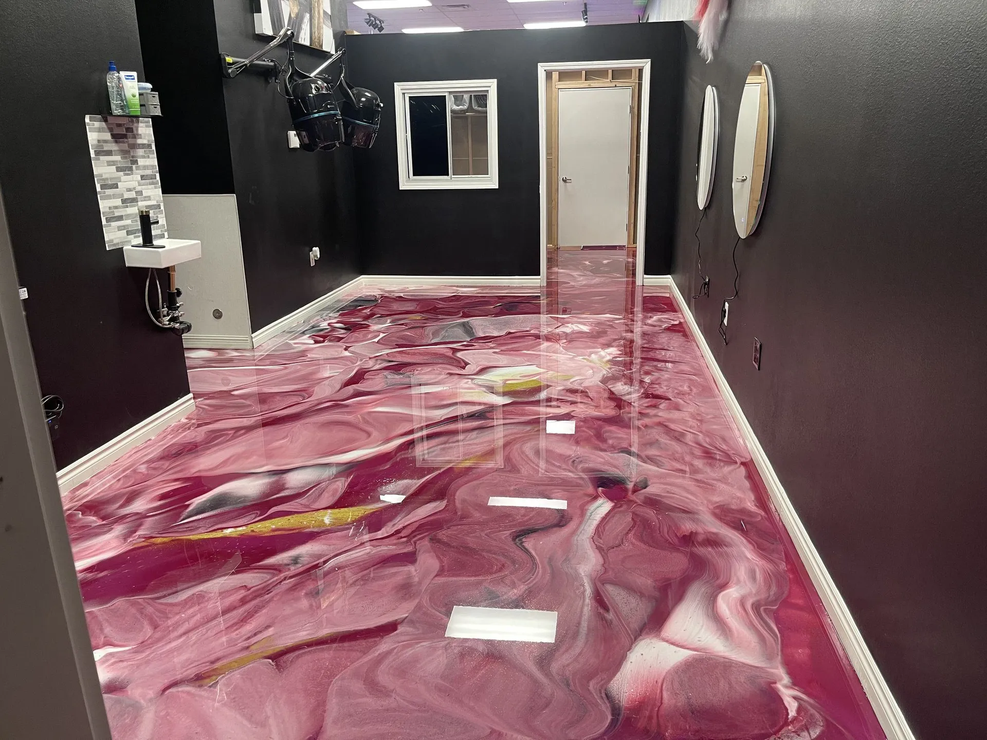 Metallic epoxy salon — custom pink and magenta commercial floor