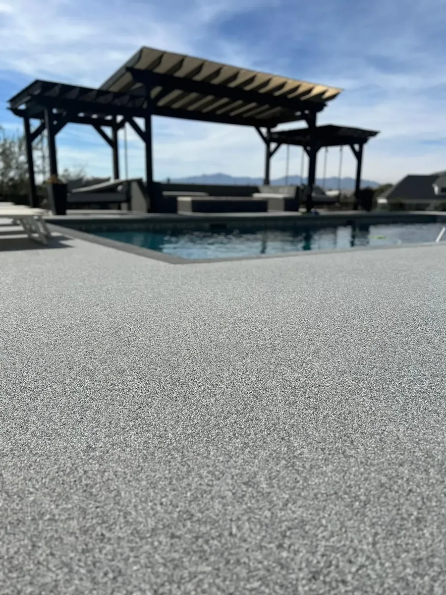 VubaStone pool deck with pergola shade structure